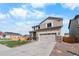 Attractive home exterior featuring a stone-accented garage and nicely maintained landscaping at 14836 Jersey Dr, Mead, CO 80542
