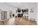 Bright living area featuring access to a backyard patio and an open view to the kitchen at 14836 Jersey Dr, Mead, CO 80542