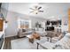 Spacious living room with an open floor plan, flowing into the kitchen and featuring lots of natural light at 14836 Jersey Dr, Mead, CO 80542
