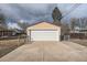 Detached two-car garage with concrete driveway and ample parking space at 4880 S Washington St, Englewood, CO 80113