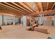 Spacious unfinished basement with exposed ceiling and concrete walls at 4023 E Geddes Cir, Centennial, CO 80122