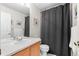 Cozy bathroom featuring a single vanity, a mirror, and a shower with a gray curtain at 4023 E Geddes Cir, Centennial, CO 80122