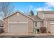 Charming townhouse featuring a two-car garage and neutral exterior at 4023 E Geddes Cir, Centennial, CO 80122