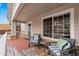Inviting front porch with comfortable seating, offering a relaxing outdoor space with ample light at 4023 E Geddes Cir, Centennial, CO 80122