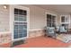 Charming front porch with seating, a decorative rug, and a window reflecting natural light at 4023 E Geddes Cir, Centennial, CO 80122