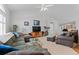 Comfortable living room showcasing ample seating, a vaulted ceiling, and a cozy ambiance at 4023 E Geddes Cir, Centennial, CO 80122