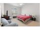 Bright bedroom features vaulted ceilings, a large window, and seating area with comfortable armchairs at 4023 E Geddes Cir, Centennial, CO 80122