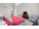 Spacious bedroom features vaulted ceilings, a ceiling fan, and comfortable armchairs at 4023 E Geddes Cir, Centennial, CO 80122