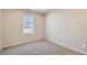 Bedroom with neutral walls, carpeted floor, and window at 17467 E 89Th Way, Commerce City, CO 80022