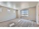 Spacious bedroom with large windows, neutral carpet and paint color at 17467 E 89Th Way, Commerce City, CO 80022