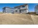 Exterior of a two-story home with a sliding glass door to the backyard and new landscaping at 17467 E 89Th Way, Commerce City, CO 80022
