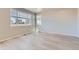 Living room featuring modern floors, natural light, and a view of the outdoors at 17467 E 89Th Way, Commerce City, CO 80022