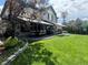 This backyard features a patio with outdoor dining and seating areas, green grass, and tasteful landscaping at 9445 Aspen Hill Cir, Lone Tree, CO 80124