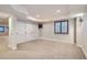 Spacious basement with neutral carpet, window, storage closet and recessed lighting at 9445 Aspen Hill Cir, Lone Tree, CO 80124