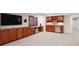 Finished basement features a built in bar, media console, and desk with lots of storage at 9445 Aspen Hill Cir, Lone Tree, CO 80124