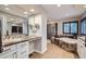 Well-lit bathroom with a soaking tub, walk-in shower, large vanity, and tile accents at 9445 Aspen Hill Cir, Lone Tree, CO 80124