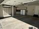 Spacious garage featuring custom white cabinets and ample storage space at 9445 Aspen Hill Cir, Lone Tree, CO 80124