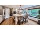 Modern kitchen with a center island with seating, stainless steel appliances, and lots of natural light at 9445 Aspen Hill Cir, Lone Tree, CO 80124