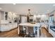 Well-lit kitchen with stainless steel appliances, subway tile backsplash, and a marble countertop center island at 9445 Aspen Hill Cir, Lone Tree, CO 80124