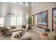 Bright living room with soaring ceilings, large windows, and stylish furnishings at 9445 Aspen Hill Cir, Lone Tree, CO 80124