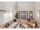 Bright living room with high ceilings, large windows, and modern furnishings at 9445 Aspen Hill Cir, Lone Tree, CO 80124
