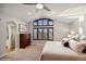 Serene main bedroom with vaulted ceiling, large window, and hardwood dresser at 9445 Aspen Hill Cir, Lone Tree, CO 80124