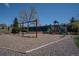 Community playground with swings, climbing structure, and slides for outdoor fun at 9445 Aspen Hill Cir, Lone Tree, CO 80124