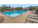 Beautiful swimming pool area with lounge chairs and a lifeguard stand at 9445 Aspen Hill Cir, Lone Tree, CO 80124