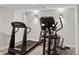 Workout room featuring a treadmill, elliptical machine, free weights and sconce lighting at 9445 Aspen Hill Cir, Lone Tree, CO 80124
