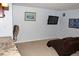 A cozy basement with a television and comfortable chair at 95 S Eagle Cir, Aurora, CO 80012