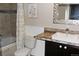 A neutral bathroom with a shower/tub and single sink vanity at 95 S Eagle Cir, Aurora, CO 80012