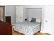 A cozy bedroom with hardwood floors and neutral color palette at 95 S Eagle Cir, Aurora, CO 80012