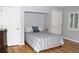 A cozy bedroom with hardwood floors and neutral color palette at 95 S Eagle Cir, Aurora, CO 80012