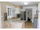 Updated kitchen with granite countertops, stainless steel appliances, and custom cabinetry at 95 S Eagle Cir, Aurora, CO 80012