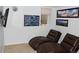 A cozy living room features two reclining chairs and mountain-themed artwork on the walls at 95 S Eagle Cir, Aurora, CO 80012