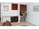 A comfortable office space with a granite desk top and suspended cabinets at 95 S Eagle Cir, Aurora, CO 80012