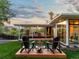 Enjoy the backyard with outdoor seating around the firepit and an expansive covered patio for easy entertaining at 11900 W 18Th Ave, Lakewood, CO 80215