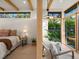 Bedroom and sun room with an abundance of natural light and backyard view at 11900 W 18Th Ave, Lakewood, CO 80215