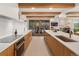 Beautiful kitchen featuring modern appliances, custom cabinetry, and an open layout at 11900 W 18Th Ave, Lakewood, CO 80215