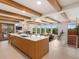 Spacious kitchen island offers seating and views of the living room and outdoor scenery at 11900 W 18Th Ave, Lakewood, CO 80215
