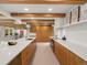 Modern kitchen with sleek countertops, custom cabinetry, and stainless steel appliances at 11900 W 18Th Ave, Lakewood, CO 80215