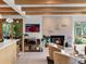 Living room with a modern fireplace, open layout, and seamless flow to the kitchen at 11900 W 18Th Ave, Lakewood, CO 80215