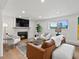 A cozy living room features a fireplace, comfortable seating, and modern decor, creating an inviting and stylish atmosphere at 11900 W 18Th Ave, Lakewood, CO 80215