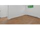 Bright room featuring wood floors and white walls, ready to be personalized at 11900 W 18Th Ave, Lakewood, CO 80215