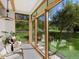 Relaxing sun room with natural light and view of a well manicured lawn at 11900 W 18Th Ave, Lakewood, CO 80215