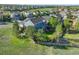 Aerial view of the home with a fenced backyard, mature trees, and a trampoline at 1909 Alpine Dr, Erie, CO 80516