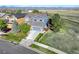 Beautiful aerial view showcasing the home's prime location near a path, greenbelt, and distant mountains at 1909 Alpine Dr, Erie, CO 80516