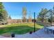 Well-maintained backyard featuring a patio, lush green lawn, and scenic views at 1909 Alpine Dr, Erie, CO 80516