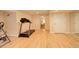 Finished basement showcasing ample space, a treadmill, and a mirrored wall for fitness at 1909 Alpine Dr, Erie, CO 80516