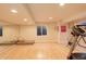 Basement with home gym including free weights, exercise equipment and mirrored wall at 1909 Alpine Dr, Erie, CO 80516